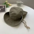 Washed vintage outdoor bucket hat in army green with adjustable windproof drawstring. - Army Green