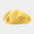 Detailed view of the solid yellow wool beret hat, ideal for stylish autumn and winter wear. - Recommended Head Circumference 56-59 cm (Elastic, Non-adjustable) / Yellow