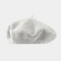 Close up view of a minimalist light grey wool beret, showcasing soft texture and fine knit detail. - Recommended Head Circumference 56-59 cm (Elastic, Non-adjustable) / Light Gray