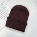 Solid color knitted beanie hat for women and men, warm winter soft cuff ski skull cap. - One Size / Brown