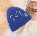 Blue knit beanie with cute bear embroidery and smiley label, warm casual winter pullover hat. - One Size / Blue