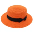 Orange straw boater hat with black bow ribbon, vintage flat top sun beach hat variant. - Orange
