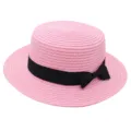 Pink straw boater hat for women, featuring a stylish black ribbon bow, summer sun protection. - Pink
