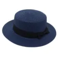 Navy blue straw boater hat featuring elegant black ribbon bow, vintage flat top summer beach hat. - Navy Blue