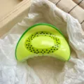 Close-up of a vibrant kiwi print hair claw clip resting on soft white tissue paper - 9cm / Kiwi Print