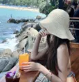Detail of handmade knitted straw hat for women's seaside vacation beach sunshade - Solid Color / Beige