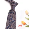 Detail shot of navy blue paisley silk tie, elegant jacquard pattern for formal business wear. - Color 005