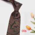 Detail view of the classic black paisley jacquard men's necktie, elegant business suit accessory. - Color 006