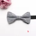 Detailed view of a classic black and white plaid bow tie with adjustable black strap. - Poly-Cotton Bow Ties-h