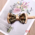 Elegant men's double-layer bow tie with stylish gold and black paisley pattern for weddings. - 011