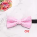 Detailed shot of a pink floral geometric men's formal business bow tie with a black strap. - Pink