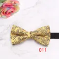 Gold floral bow tie detail, elegant pattern texture close-up for formal business wear. - Gold