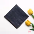 Detailed shot of a dark blue jacquard pocket square with paisley pattern for formal events. - Style 14