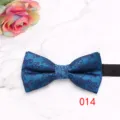 Close-up detail of a stylish blue men's bow tie with elegant purple floral pattern texture. - Blue Jacquard Pattern