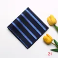 Detailed view of the dark blue striped pocket square with delicate jacquard texture. - Style 21