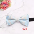 Detail view of the blue and gold paisley bow tie, featuring elegant floral pattern for suits. - Blue and Gold Pattern