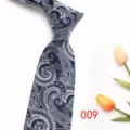 Detail shot of the classic paisley jacquard men's tie, showcasing fine fabric texture and pattern. - Color 009