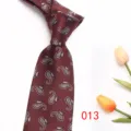 Detailed close-up view of a classic red paisley jacquard men's tie for business suits. - Color 013