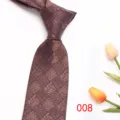 Detailed shot of brown woven men tie, elegant texture and fine craftsmanship for business wear. - Color 008