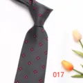 Close-up detail of the classic grey men's tie featuring elegant red floral pattern design. - 017