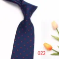 Classic men's navy blue necktie featuring elegant red geometric dot pattern for business wear. - Color 022