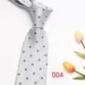 Detail view of light grey business men's tie with classic small clover pattern. - Color 004