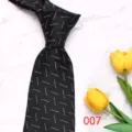 Men's black silk-like polyester tie featuring a stylish geometric white dot pattern for business. - Color 007