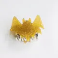 Quirky yellow glitter bat-shaped hair claw clip for trendy Halloween fashion - Yellow