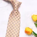 Detail view of a classic golden geometric pattern silk tie with elegant floral motifs for men. - No. 006 - Golden Small Flowers