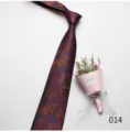 Detailed close-up view of a men's vintage floral jacquard tie with a elegant bouquet. - Color 014