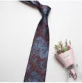 Close-up detail shot of vintage floral jacquard necktie in dark red and blue, elegant pattern. - Color 016