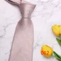 Light pink paisley necktie close-up, elegant fabric texture for business and wedding suits. - No. 012 - Classic Paisley