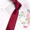 Red wedding necktie detail showing the double happiness emblem and smooth silk texture. - Color 002