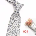 Men's silk jacquard tie detail showing vintage leaf pattern and elegant knot design. - No.004 Leaf Pattern