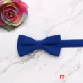 Blue velvet children's bow tie detail showing the soft fabric texture and elegant design close up. - Style M