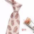 Detailed view of men's business retro tie featuring elegant jacquard feather pattern in soft tone. - No.011 Light Pink Feather