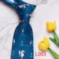 Detailed view of the blue necktie featuring cute seahorse and anchor prints, elegant fabric. - L003