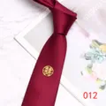 Detail view of wine red wedding tie featuring gold double happiness emblem and love 1314. - 012