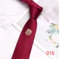 Burgundy wedding necktie fabric detail showing elegant golden double happiness symbol charm ornament. - Color 015