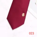 Close-up detail of burgundy men wedding necktie with gold double happiness decoration. - Color 023