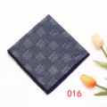 Detailed view of a stylish dark blue checkered pocket square for men suits and formal wear. - Color 016