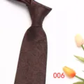 Brown men jacquard tie detail showing elegant leaf pattern and fine texture for business. - Dark Brown