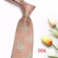 Detail view of the elegant men's floral jacquard tie with vintage woven pattern and silky finish. - Color 006