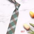 Detailed view of the elegant green business tie featuring classic striped pattern and fine fabric. - 8cm 007
