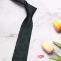Dark green men's business tie with leaf pattern detail, elegant polyester fabric style. - 7CM009