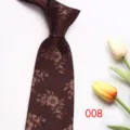 Close-up view of a dark brown mens tie featuring a floral jacquard pattern, elegant detail. - Color 008