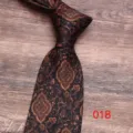 Classic paisley pattern men tie detail view, elegant vintage black fabric design for formal suit. - Color 018