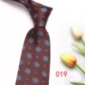 Burgundy men's tie with blue medallion pattern for formal business or wedding attire details. - Color 019