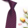 Detail view of men's dark red striped tie with classic navy diagonal patterns and sleek fabric. - Color 021