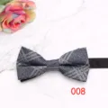 Detailed shot of a classic blue-grey plaid men's bow tie on a marble background with rose. - Color 008